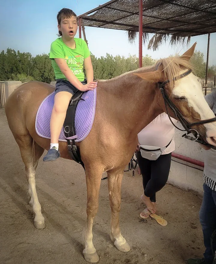 A child with disability riding a horse
