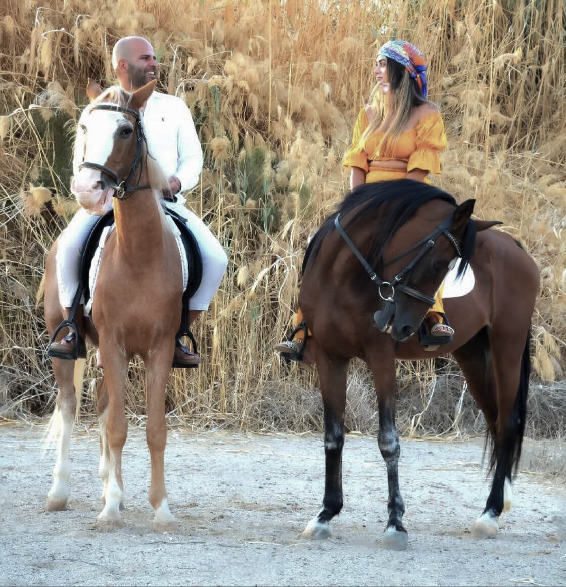 Two people riding horses in Hurghada